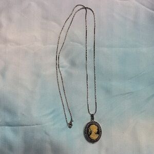 Vanity Fair Silver and Gold Cameo Necklace- NEED BATTERY.